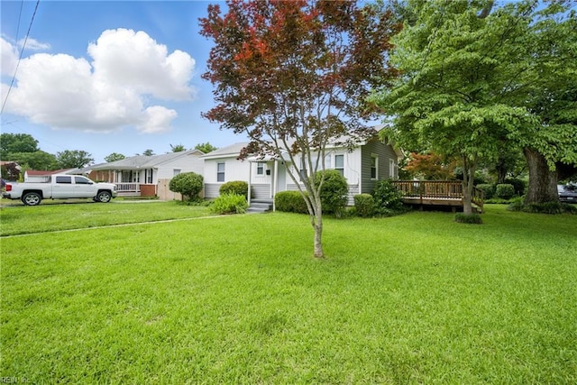 4400 Bart St, Portsmouth, VA 23707 - view of front of property with a front yard and a wooden deck