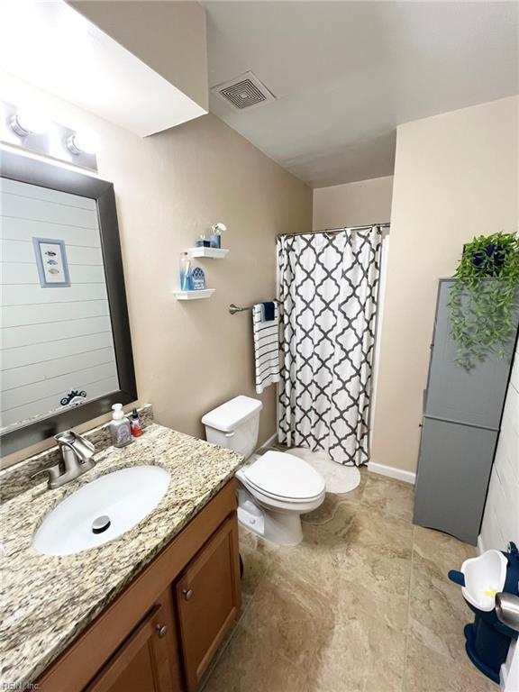 5806 Edith Ct, Virginia Beach, VA 23464 - bathroom with vanity and a shower with curtain