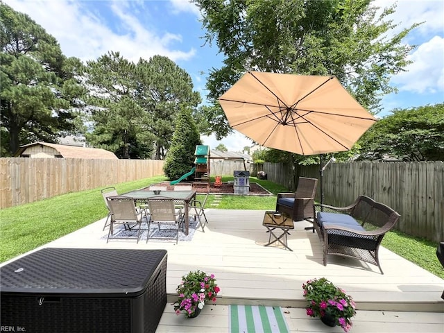 5806 Edith Ct, Virginia Beach, VA 23464 - wooden deck with a playground, outdoor dining area, and a fenced backyard