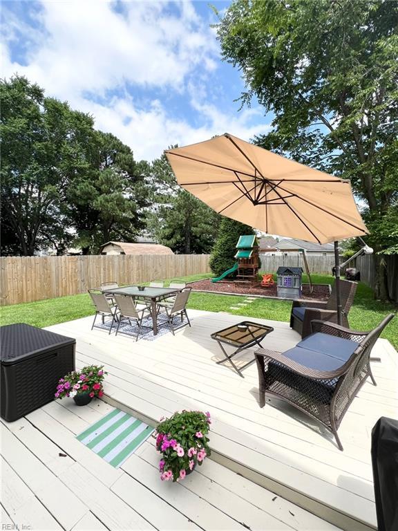 5806 Edith Ct, Virginia Beach, VA 23464 - wooden deck with a playground, a fenced backyard, and outdoor dining space