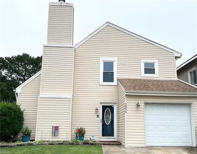 5806 Edith Ct, Virginia Beach, VA 23464 - view of front of home with an attached garage, a chimney, and a shingled roof