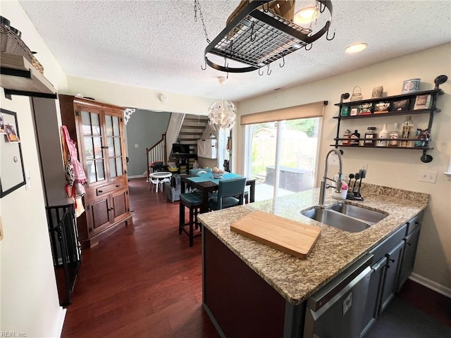 5806 Edith Ct, Virginia Beach, VA 23464 - kitchen with a textured ceiling, stainless steel dishwasher, dark wood finished floors, a peninsula, and decorative light fixtures