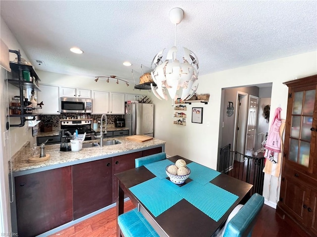5806 Edith Ct, Virginia Beach, VA 23464 - dining space featuring a textured ceiling, wood finished floors, a chandelier, and recessed lighting