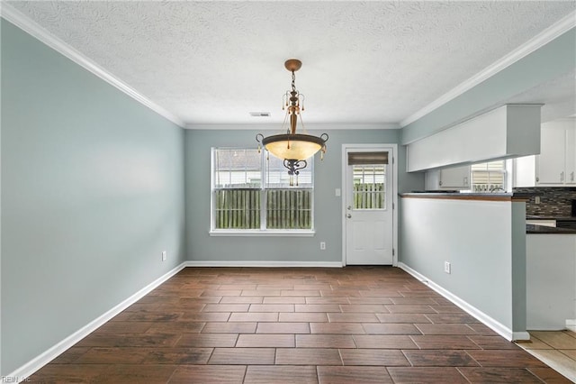 864 Page Pl, Newport News, VA 23608 - unfurnished dining area featuring wood finish floors, ornamental molding, a textured ceiling, and a chandelier