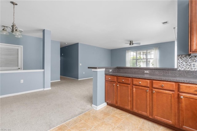 5205 Nuthall Dr Unit 202, Virginia Beach, VA 23455 - kitchen with ceiling fan, light carpet, open floor plan, brown cabinetry, and dark countertops