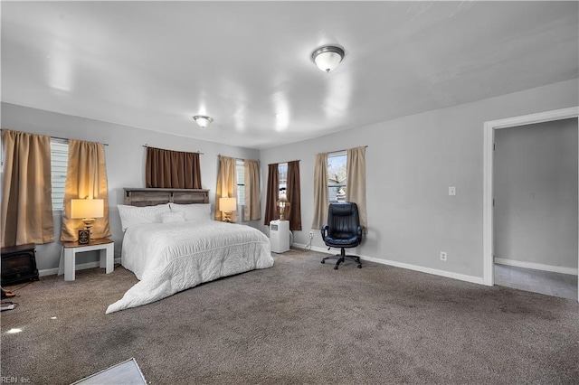 1047 26th St, Newport News, VA 23607 - carpeted bedroom featuring baseboards and a wood stove