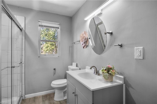 1047 26th St, Newport News, VA 23607 - full bathroom with a stall shower, wood finished floors, and vanity