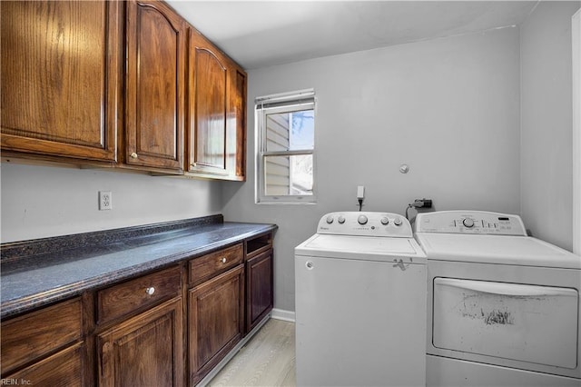 1047 26th St, Newport News, VA 23607 - laundry area featuring cabinet space, independent washer and dryer, and light wood finished floors