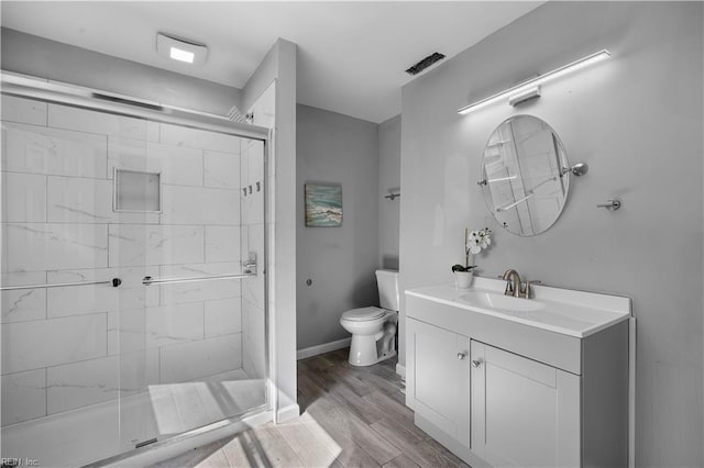 1047 26th St, Newport News, VA 23607 - bathroom with a stall shower, vanity, and wood finished floors