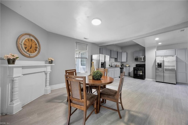 1047 26th St, Newport News, VA 23607 - dining area featuring light wood-type flooring and recessed lighting
