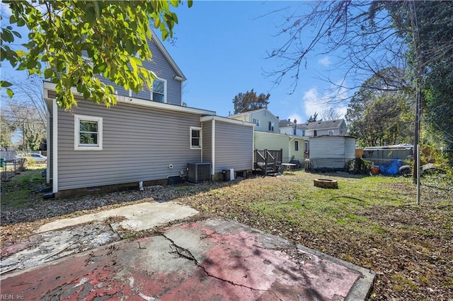 1047 26th St, Newport News, VA 23607 - back of property with an outdoor fire pit, crawl space, and a patio