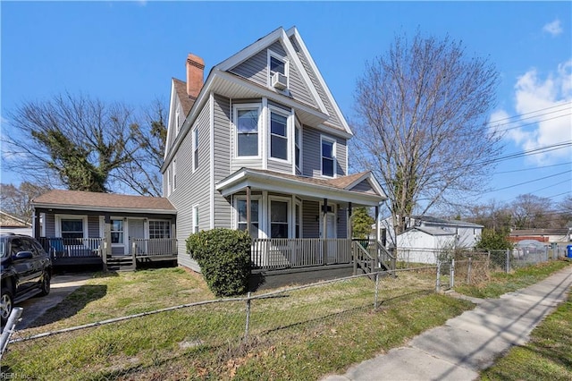 1047 26th St, Newport News, VA 23607 - view of front of house featuring a porch and a chimney