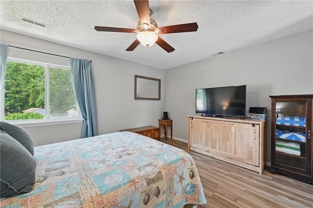 1712 Willwood Ct, Virginia Beach, VA 23464 - bedroom with wood finished floors, a textured ceiling, and a ceiling fan