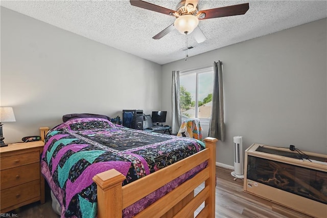 1712 Willwood Ct, Virginia Beach, VA 23464 - bedroom with a textured ceiling, wood finished floors, and ceiling fan