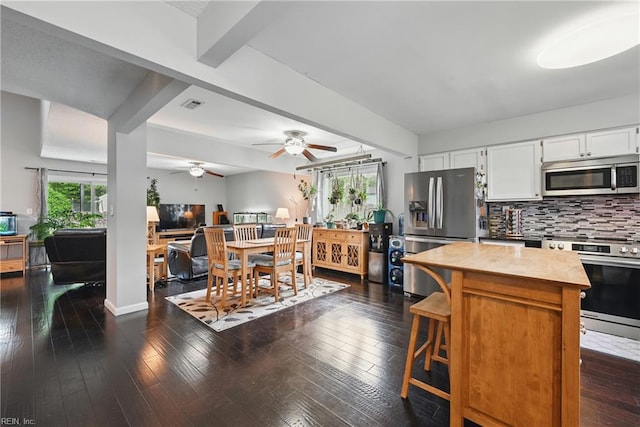 1712 Willwood Ct, Virginia Beach, VA 23464 - kitchen featuring appliances with stainless steel finishes, a ceiling fan, beamed ceiling, tasteful backsplash, and white cabinets