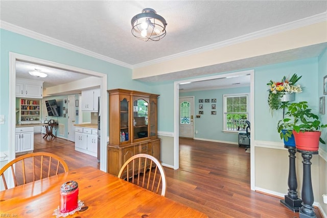 301 Ashland Ct, Newport News, VA 23606 - dining area with wood finished floors, a textured ceiling, and ornamental molding