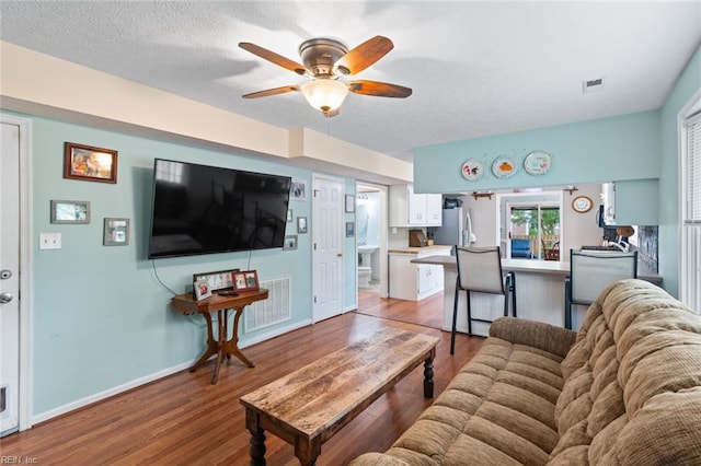 301 Ashland Ct, Newport News, VA 23606 - living area with light wood-style flooring, ceiling fan, and a textured ceiling