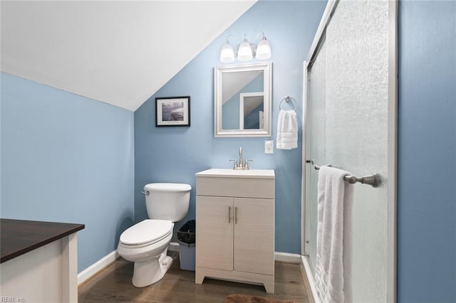 301 Ashland Ct, Newport News, VA 23606 - full bathroom featuring vanity, wood finished floors, vaulted ceiling, and a stall shower