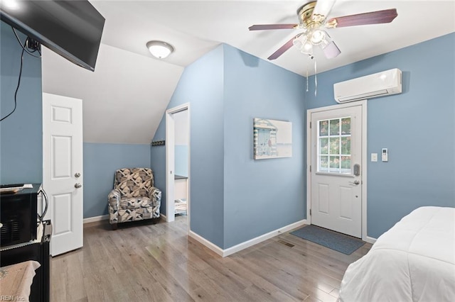 301 Ashland Ct, Newport News, VA 23606 - bedroom featuring a wall mounted AC, wood finished floors, lofted ceiling, and a ceiling fan