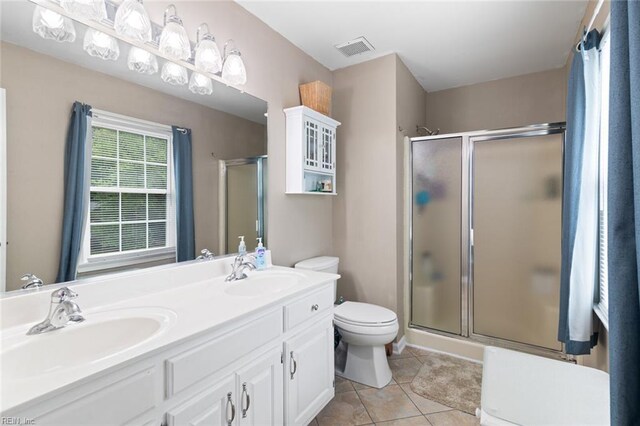 301 Ashland Ct, Newport News, VA 23606 - bathroom featuring a stall shower, tile patterned floors, and double vanity