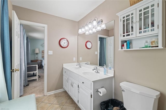 301 Ashland Ct, Newport News, VA 23606 - ensuite bathroom featuring double vanity and tile patterned floors