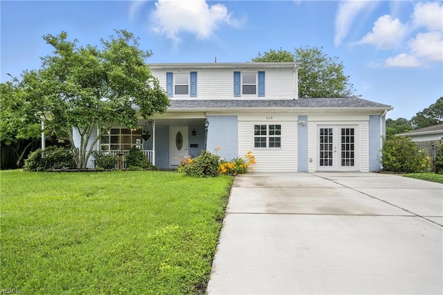 608 Woodbine Ln, Virginia Beach, VA 23452 - traditional-style house featuring french doors, a front yard, and covered porch