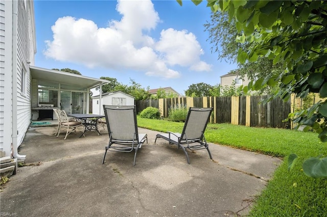 608 Woodbine Ln, Virginia Beach, VA 23452 - fenced backyard featuring a shed, a patio area, and outdoor dining area