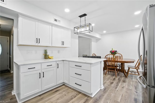 608 Woodbine Ln, Virginia Beach, VA 23452 - kitchen featuring freestanding refrigerator, white cabinets, light wood-type flooring, and recessed lighting