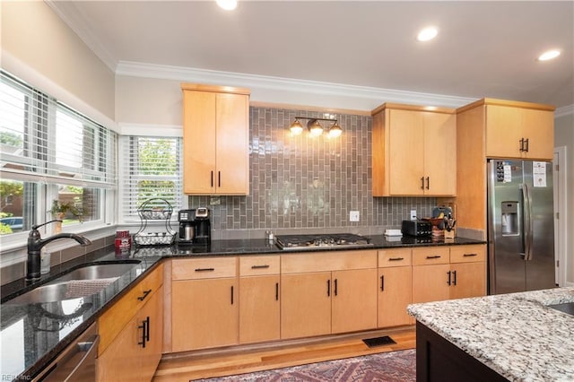 3516 Colmar Quarter Quarter, Norfolk, VA 23509 - kitchen with stainless steel appliances, light brown cabinets, crown molding, dark stone countertops, and decorative backsplash