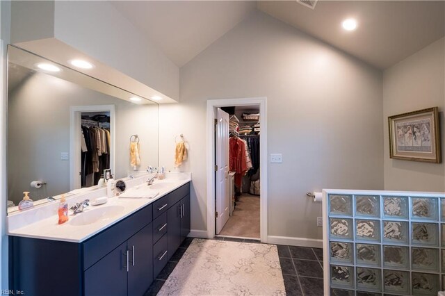 3516 Colmar Quarter Quarter, Norfolk, VA 23509 - bathroom featuring double vanity, a walk in closet, lofted ceiling, tile patterned floors, and recessed lighting