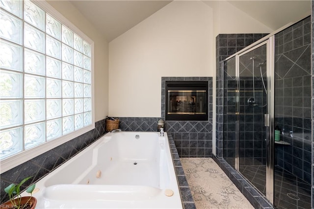 3516 Colmar Quarter Quarter, Norfolk, VA 23509 - full bathroom with vaulted ceiling, healthy amount of natural light, a whirlpool tub, a shower stall, and a fireplace