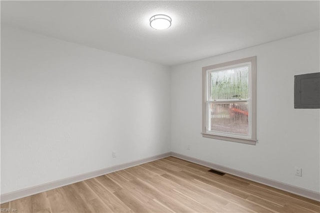 2370 Pruden Blvd, Suffolk, VA 23434 - spare room featuring electric panel and light wood-type flooring