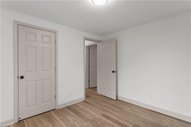 2370 Pruden Blvd, Suffolk, VA 23434 - unfurnished bedroom featuring light wood-style flooring and baseboards