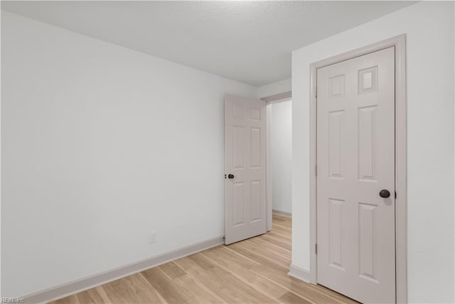 2370 Pruden Blvd, Suffolk, VA 23434 - unfurnished bedroom with light wood-style floors and baseboards