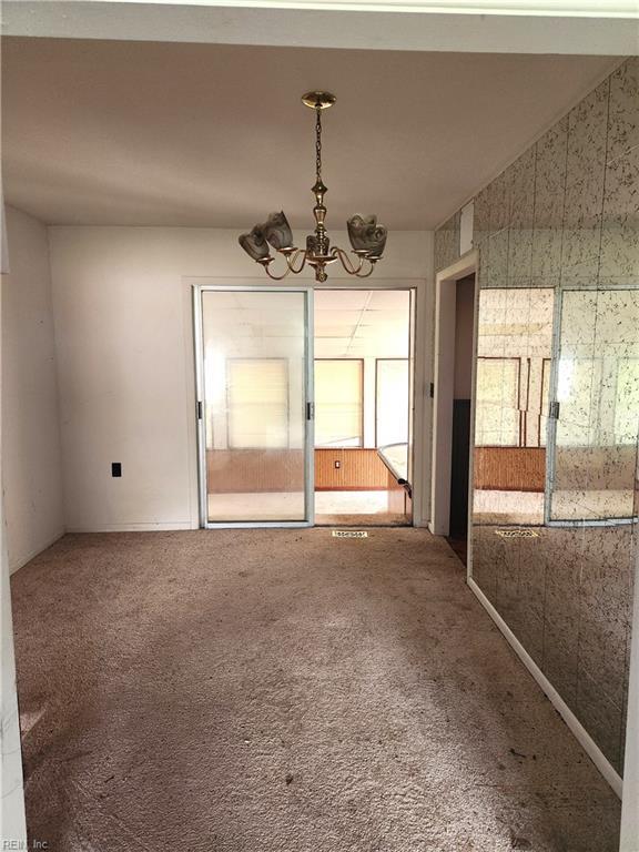 219 Cellardoor Ct, Hampton, VA 23666 - unfurnished dining area with a chandelier and carpet flooring