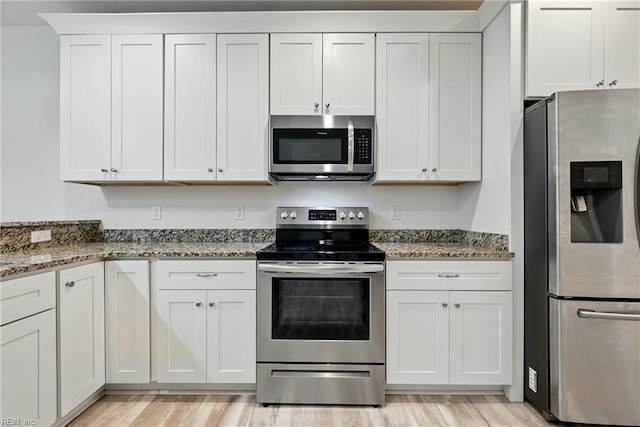 3005 Overbrook Ave, Norfolk, VA 23513 - kitchen featuring stainless steel appliances, light stone counters, white cabinetry, and light wood-type flooring