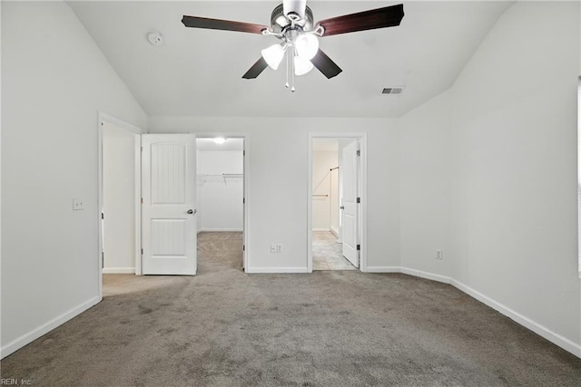 3005 Overbrook Ave, Norfolk, VA 23513 - unfurnished bedroom with lofted ceiling, a walk in closet, carpet floors, a closet, and connected bathroom