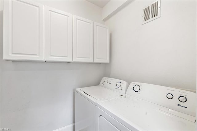 1718 Fontainebleau Cres, Norfolk, VA 23509 - laundry area featuring cabinet space and washer and clothes dryer