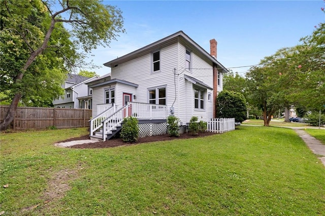 1718 Fontainebleau Cres, Norfolk, VA 23509 - rear view of house with a chimney and a wooden deck