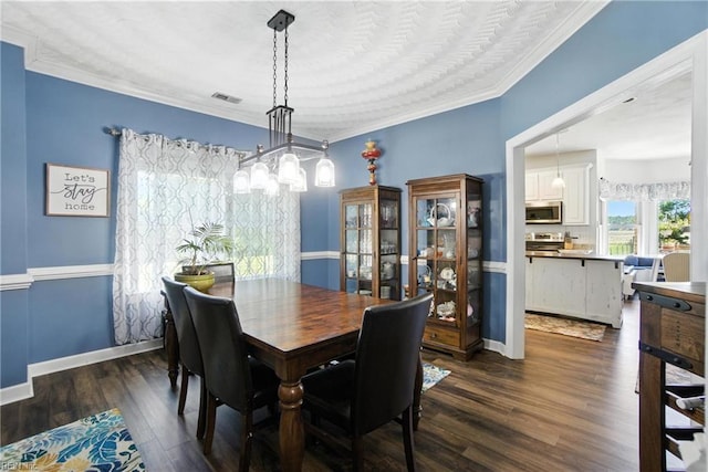 609 Trumpet Ct, Chesapeake, VA 23323 - dining space with crown molding and dark wood-style floors