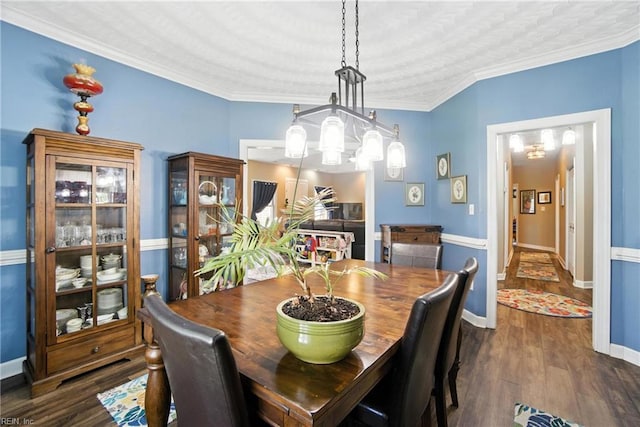 609 Trumpet Ct, Chesapeake, VA 23323 - dining space with dark wood-style floors, ornamental molding, and a chandelier