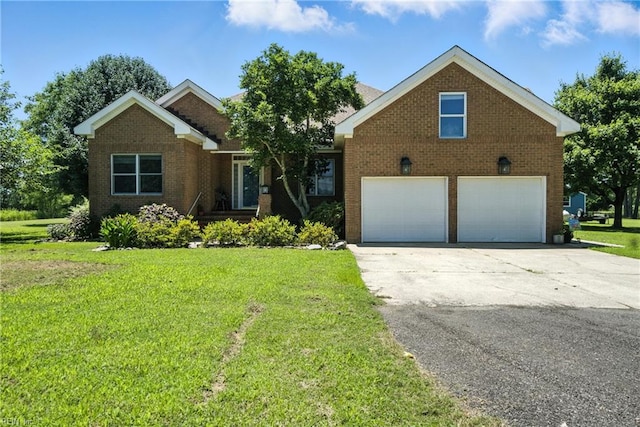 609 Trumpet Ct, Chesapeake, VA 23323 - view of front of house with brick siding, a front yard, a garage, and concrete driveway
