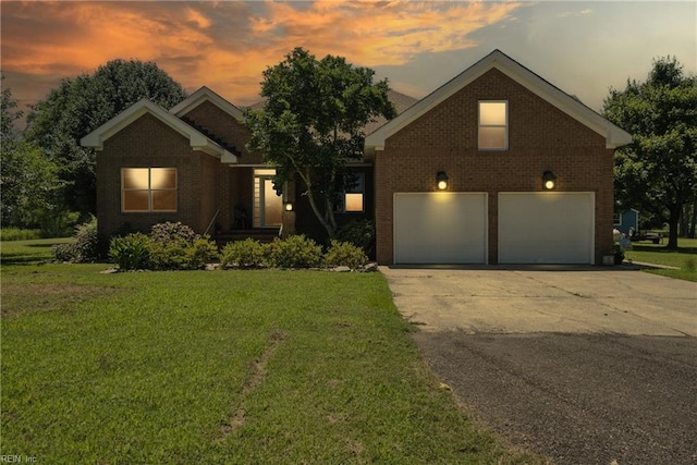 609 Trumpet Ct, Chesapeake, VA 23323 - view of front facade with brick siding, a yard, concrete driveway, and an attached garage