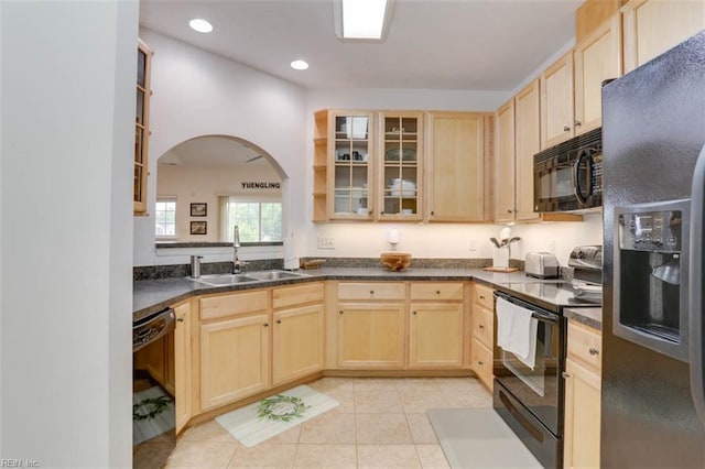 1004 Rustads Cir, Williamsburg, VA 23188 - kitchen featuring black appliances, light brown cabinets, arched walkways, glass insert cabinets, and recessed lighting