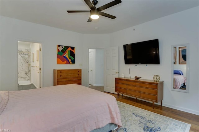 1004 Rustads Cir, Williamsburg, VA 23188 - bedroom featuring wood finished floors, ensuite bath, and a ceiling fan