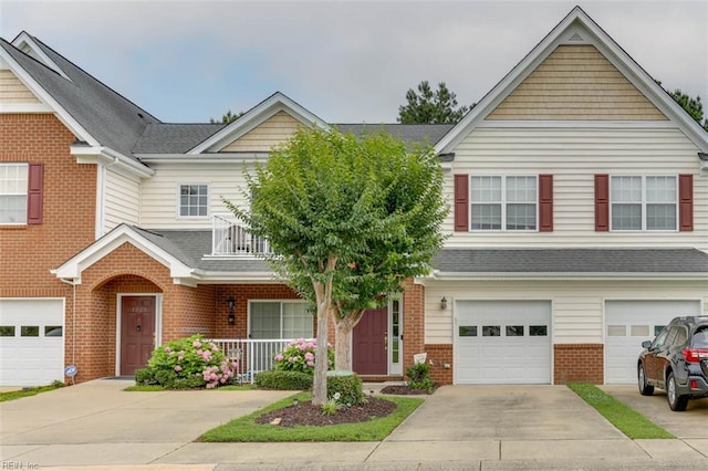 1004 Rustads Cir, Williamsburg, VA 23188 - traditional-style home with brick siding, driveway, an attached garage, a porch, and a balcony