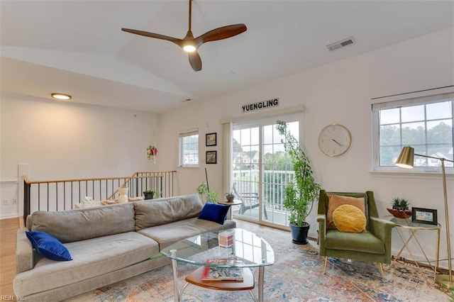 1004 Rustads Cir, Williamsburg, VA 23188 - living area with healthy amount of natural light, vaulted ceiling, ceiling fan, and wood finished floors