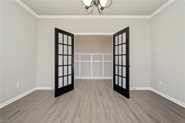 2245 Captiva Ln, Chesapeake, VA 23321 - unfurnished room with french doors, wood finished floors, a chandelier, and ornamental molding
