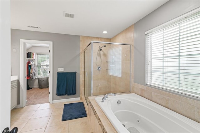 308 Queen Ct, Smithfield, VA 23430 - bathroom with a whirlpool tub, a stall shower, tile patterned floors, a spacious closet, and recessed lighting