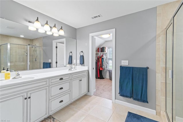 308 Queen Ct, Smithfield, VA 23430 - full bath featuring a shower stall, double vanity, a spacious closet, and tile patterned flooring